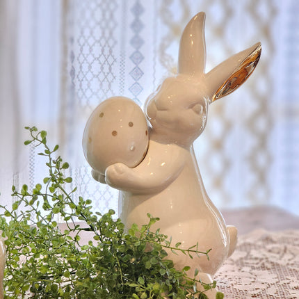 White Ceramic Bunny with Egg and Gold Accents