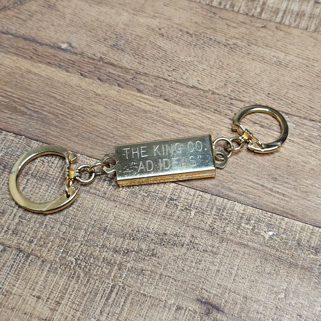 Vintage Gold-Toned Metal "The King Co. Bad Ideas" Kingsman-style Keychain